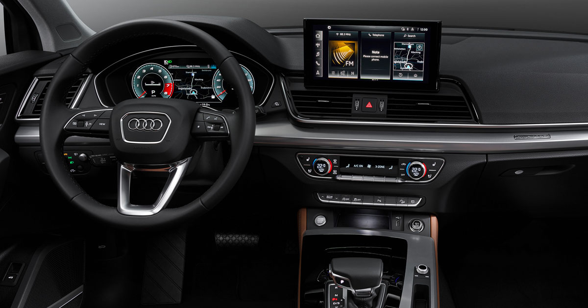 New 2020 Audi Q5 interior centre console and steering wheel shot