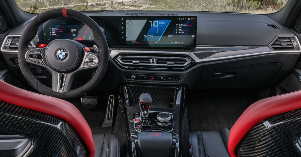 An image of the 2023 BMW M3 CS showing the interior dashboard area and steering wheel