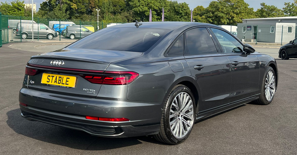 An image of a 2022 Audi A8 Saloon from the rear