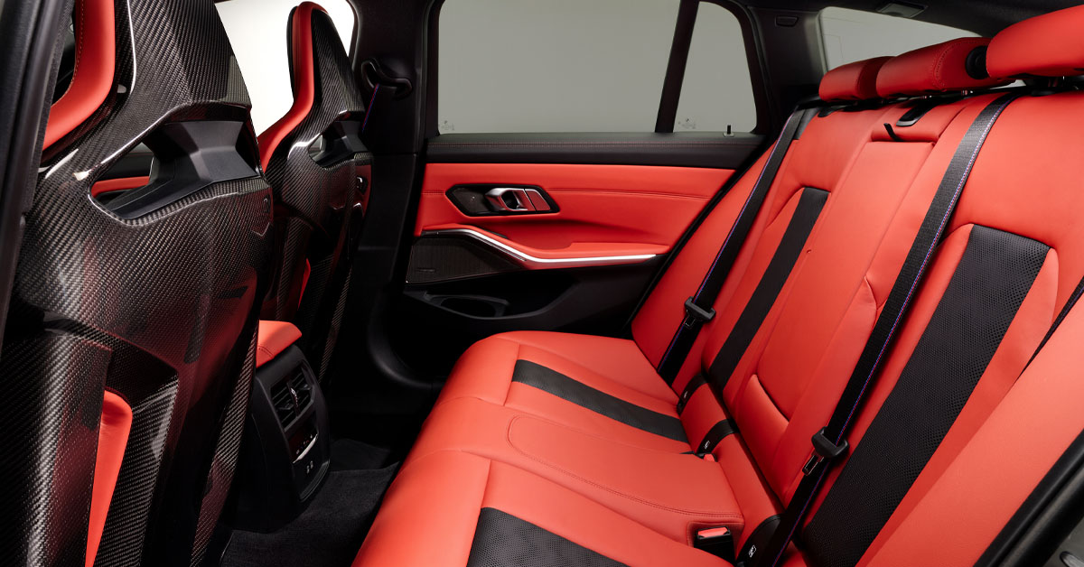 An image of the 2022 BMW M3 Competition Touring xDrive interior rear passenger seats