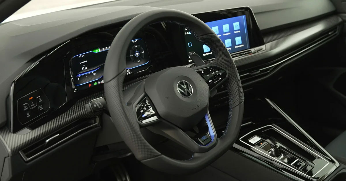 An image of the 2022 20th anniversary Volkswagen Golf R Mk8 showing the carbon fibre trim dashboard