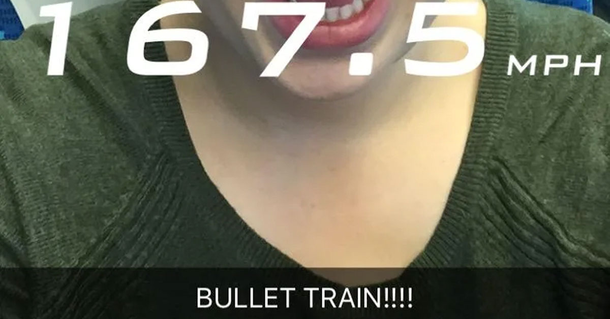 An image of a lady on a train using the Snapchat speed filter