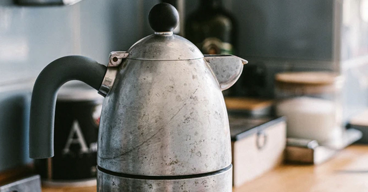 An image of a kettle with hot water inside